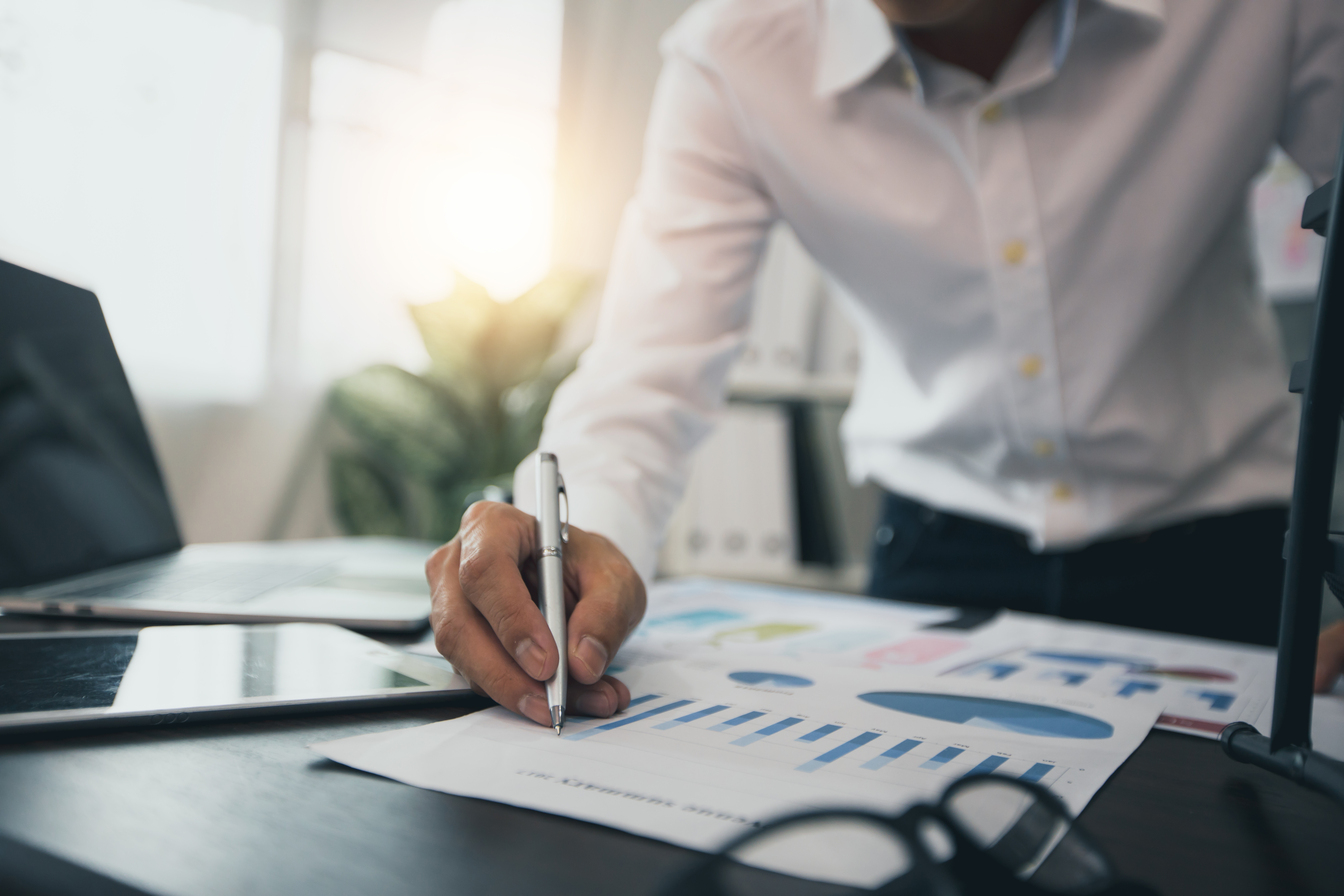 Businesswoman Accountant analyzing investment charts Invoice and